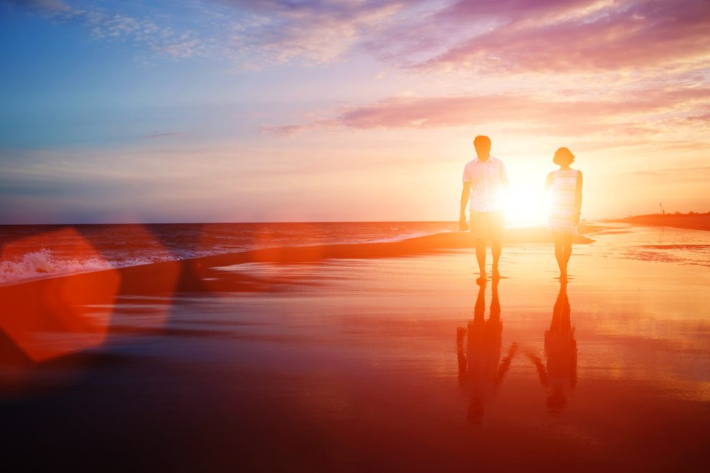 couple walking on a beach